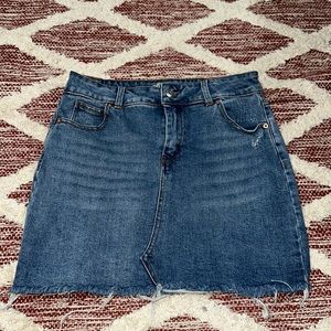 Blue jeans skirt with front pockets and back pockets in good condition